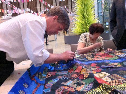 Volunteers work on the &quot;Mending Boston&quot; quilt at the Museum of Fine Arts. (Courtesy photo)