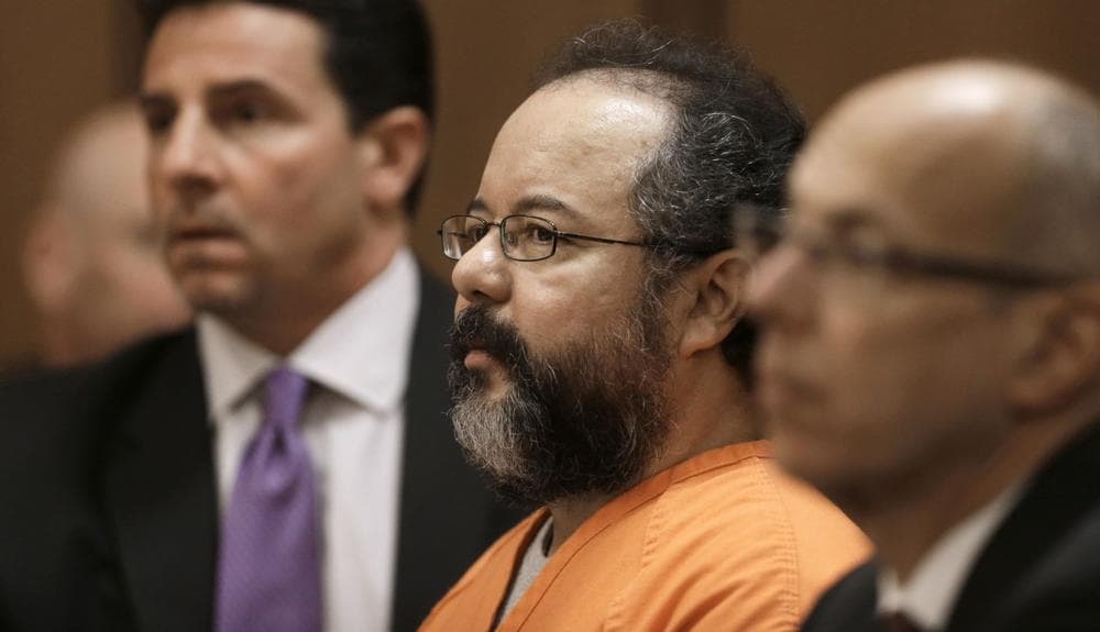 Ariel Castro, center, listens to the judge during court proceedings Friday, July 26, 2013, in Cleveland. (Tony Dejak/AP)