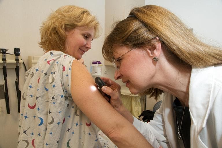 Christiana Care Health System dermatologist Dr. Cynthia Webster (right) examines Kim Palmer for skin cancer. (Christiana Care/Flickr)