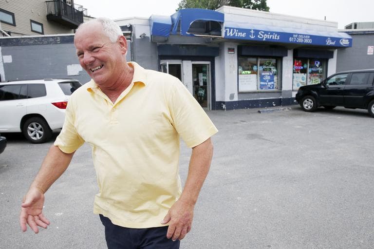 Stephen Rakes smiles after greeting outside the liquor store he once owned in South Boston. (Michael Dwyer/AP)