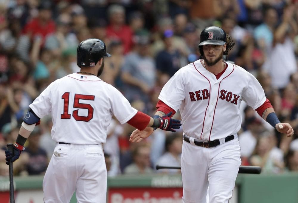 Red Sox's Jarrod Saltalamacchia right, celebrates with Red Sox's Dustin Pedroia, left, after scoring on an RBI single by Red Sox's Jacoby Ellsbury. (AP/Steven Senne)
