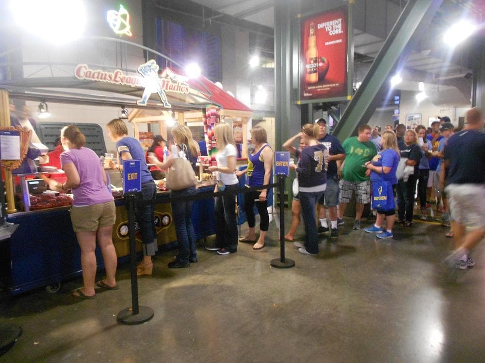 The crowd at a Miller Park concession stand as people wait to use their $10 vouchers.  (LaToya Dennis/Only A Game)