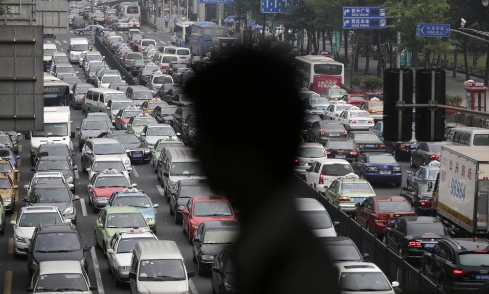 A street becomes clogged with traffic in Shanghai, China, Wednesday, May 29, 2013. With more than 13 million cars were sold in China last year. (Eugene Hoshiko/AP)