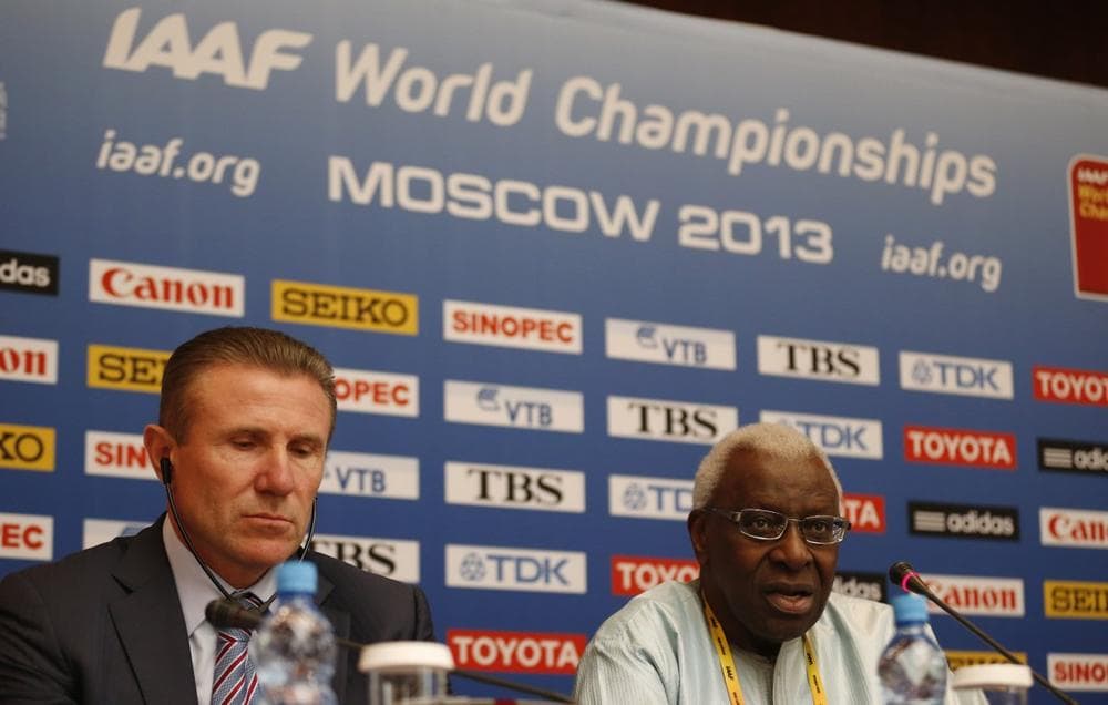 IAAF president Lamine Diack, right, speaks alongside retired athlete and IAAF vice president Sergey Bubka during a news conference at a hotel in Moscow, Thursday, Aug. 8, 2013. (Matt Dunham/AP)