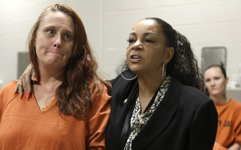 Kathryn Griffin-Townsend, right, hugs Harris County jail inmate Tricia Chambers, as they talk about Chambers' life in prostitution Tuesday, June 4, 2013, in Houston. (Pat Sullivan/AP)