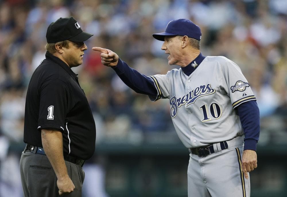 If all goes according to plan, Major League Baseball's proposal to increase the use of instant replay will cut down on disputes between umpires and managers &mdash; like this one between umpire Bruce Dreckman and Milwaukee manager Ron Roenicke. (Ted S. Warren/AP)