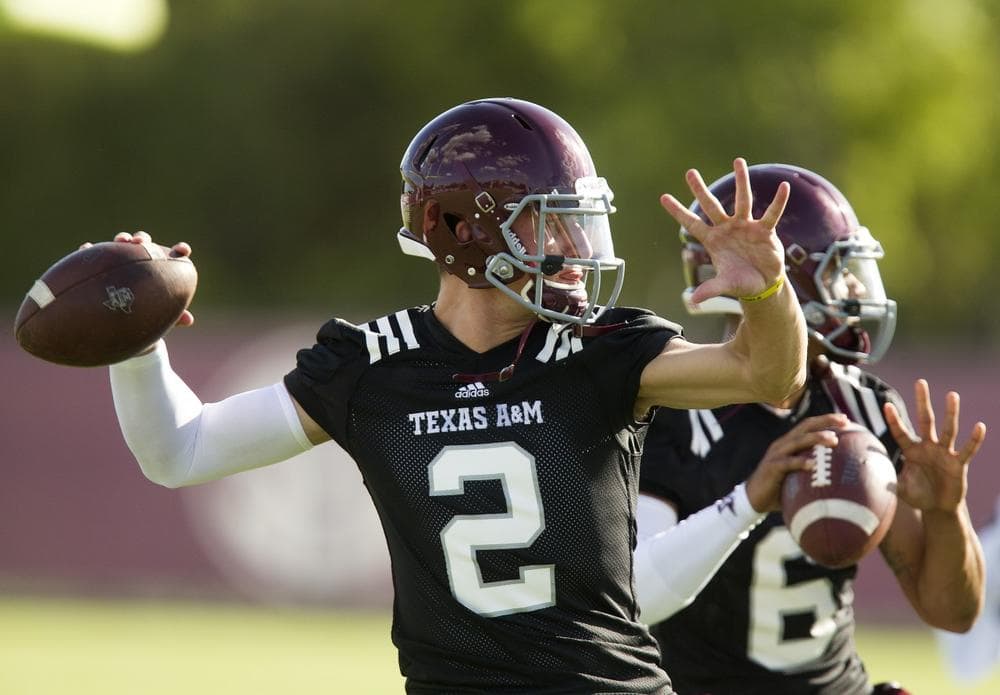 Texas A&amp;M quarterback Johnny Manziel has received much scrutiny this offseason &mdash; and not because of his play on the field. (Patric Schneider/AP)