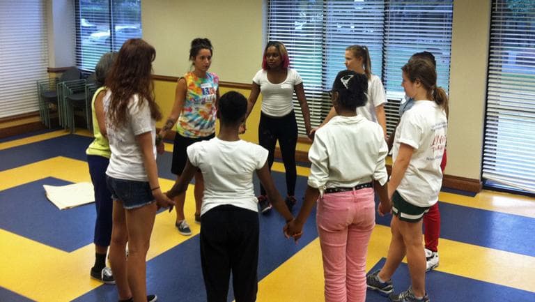 Young women participate in the Girls' LEAP self-dense class in Roxbury. (Delores Handy/WBUR)