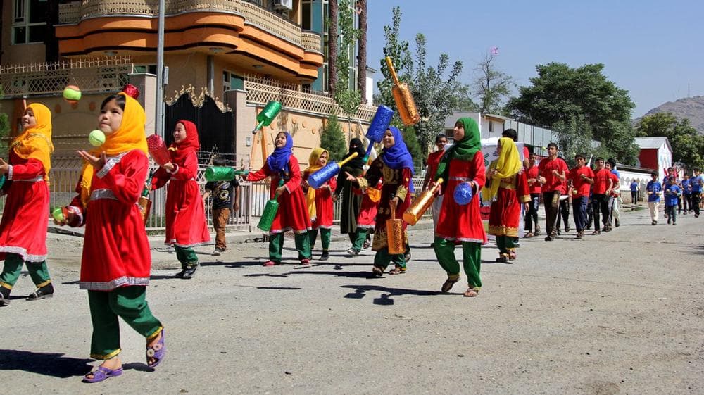 Students at the Afghan Mobile Mini Circus for Children participate in the juggling parade on the streets of Kabul before Afghanistan's eighth annual national juggling championship last week. (Sean Carberry/NPR)
