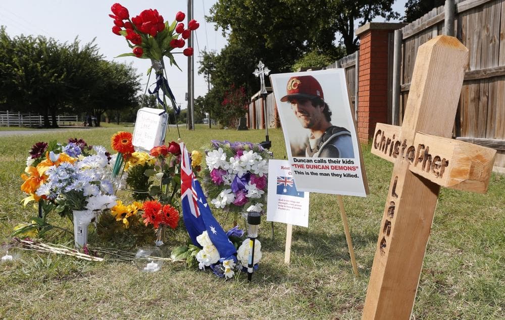 A memorial to Christopher Lane is shown Tuesday, Aug. 20, 2013, along the road where he was shot and killed, in Duncan, Okla. (Sue Ogrocki/AP)
