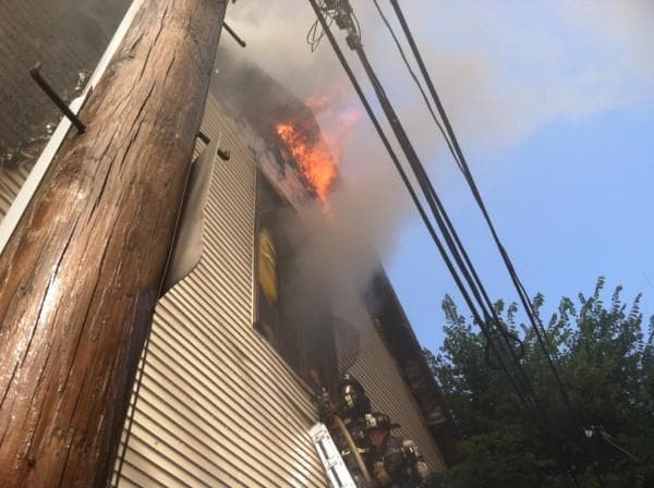 Fire pours out of the roof of the St. John the Baptist Albanian Orthodox Church in South Boston. (Boston Fire Department)