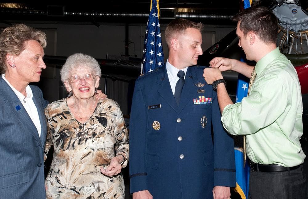 Air Force Major Jeff Mueller, second from right, is pictured with his mother, grandmother and partner Eric Gustafson, at Mueller&#039;s promotion ceremony to Major at the Peterson Air Force Base Museum in Colorado Springs, September 26, 2011. (Courtesy of Jeff Mueller)