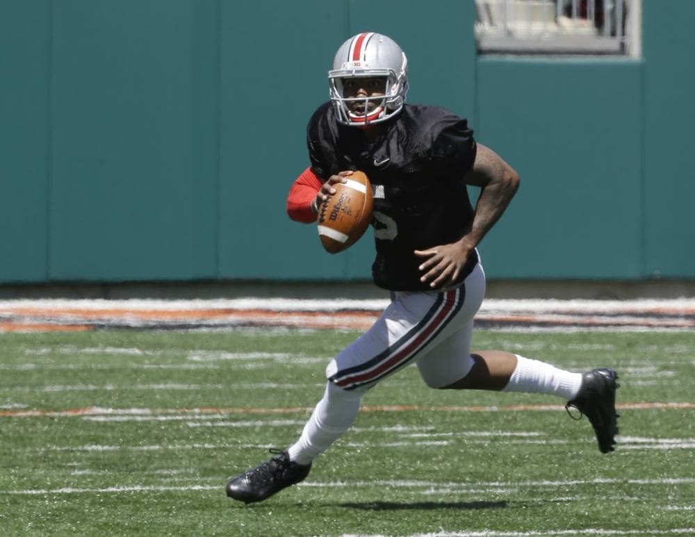 After throwing for 2,039 yards and 15 touchdowns as a sophomore, Ohio State quarterback Braxton Miller enters his junior year as a Heisman candidate. (Al Behrman/AP)