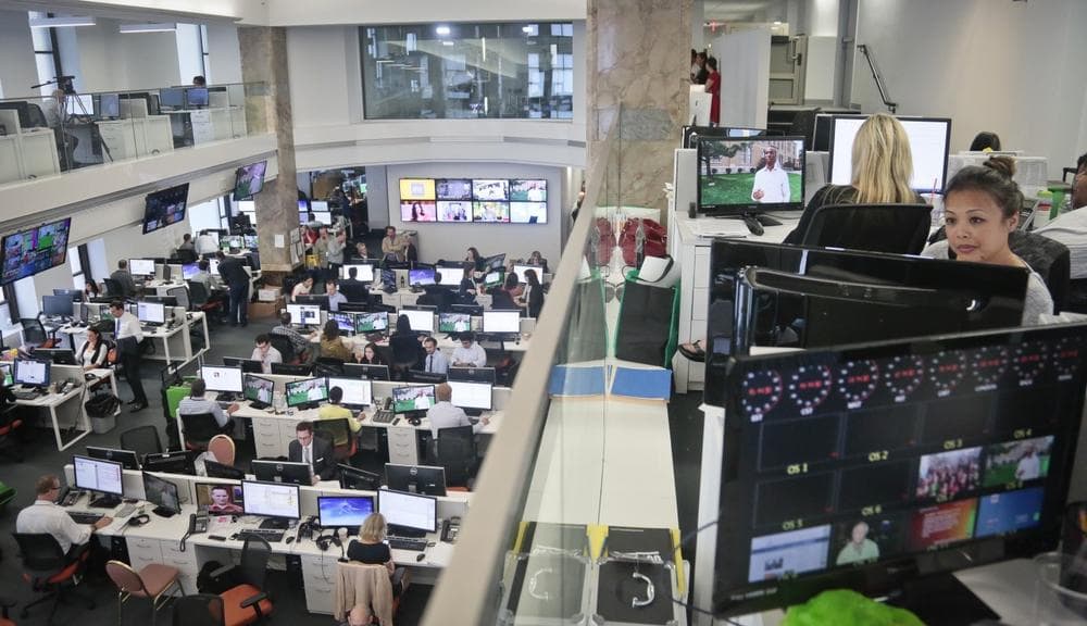 Staffers work in the Al-Jazeera America newsroom after the network's first broadcast on Tuesday, Aug. 20, 2013 in New York. (Bebeto Matthews/AP)