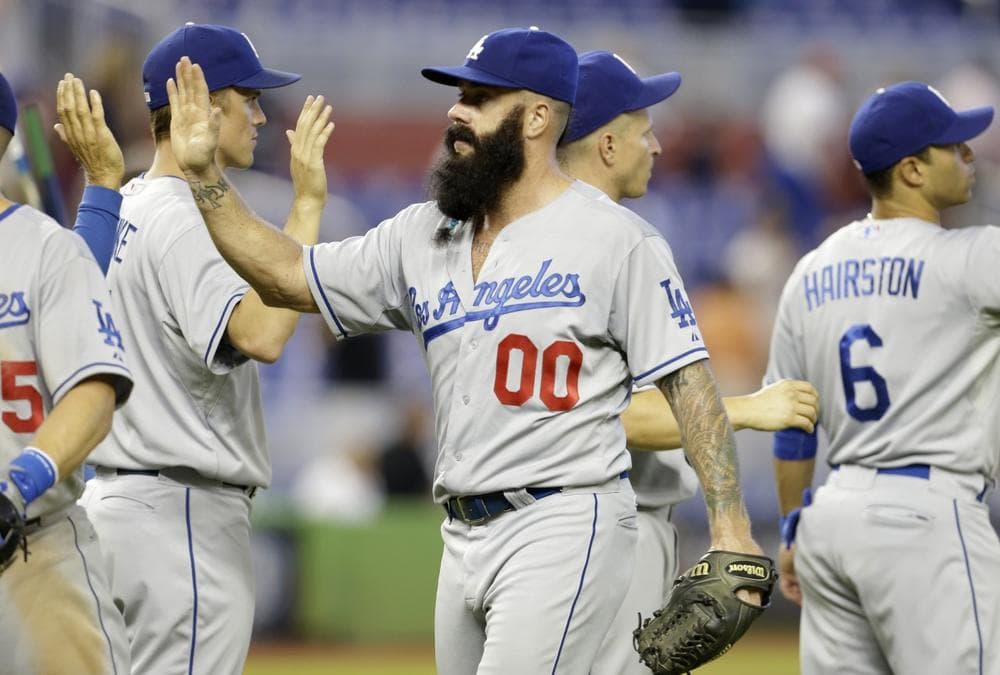 After recovering from Tommy John surgery, Brian Wilson and his beard are back at work, but Wilson could make some extra income by shearing his trademark. (Lynne Sladky/AP)