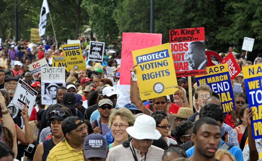 Demonstrators march towards the Martin Luther King Jr. Memorial during the 50th anniversary commemoration of the 1963 March on Washington Saturday, Aug. 24, 2013, in Washington. (Jose Luis Magana/AP)