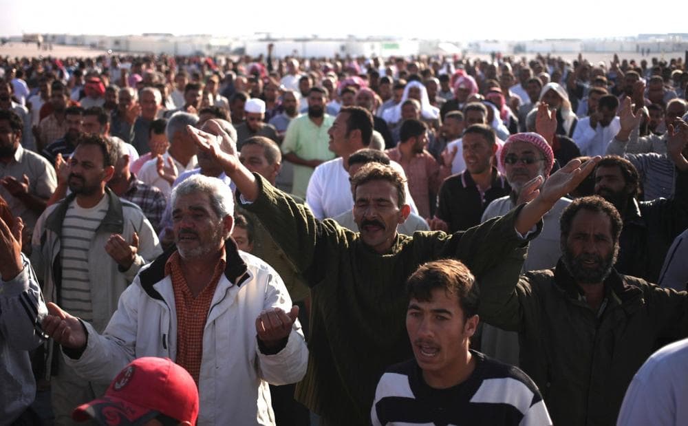 Syrian refugees chant slogans against Syrian President Bashar Assad at Zaatari Syrian refugee camp in Mafraq, Jordan, Thursday, Aug. 8, 2013. (Mohammad Hannon/AP)