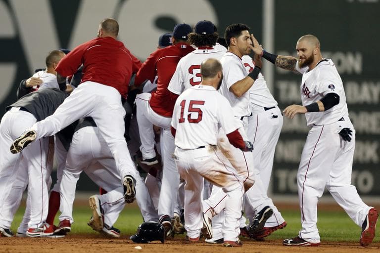 The Red Sox including celebrate after a walkoff-single by Daniel Nava that scored Dustin Pedroia in the ninth inning. (AP)