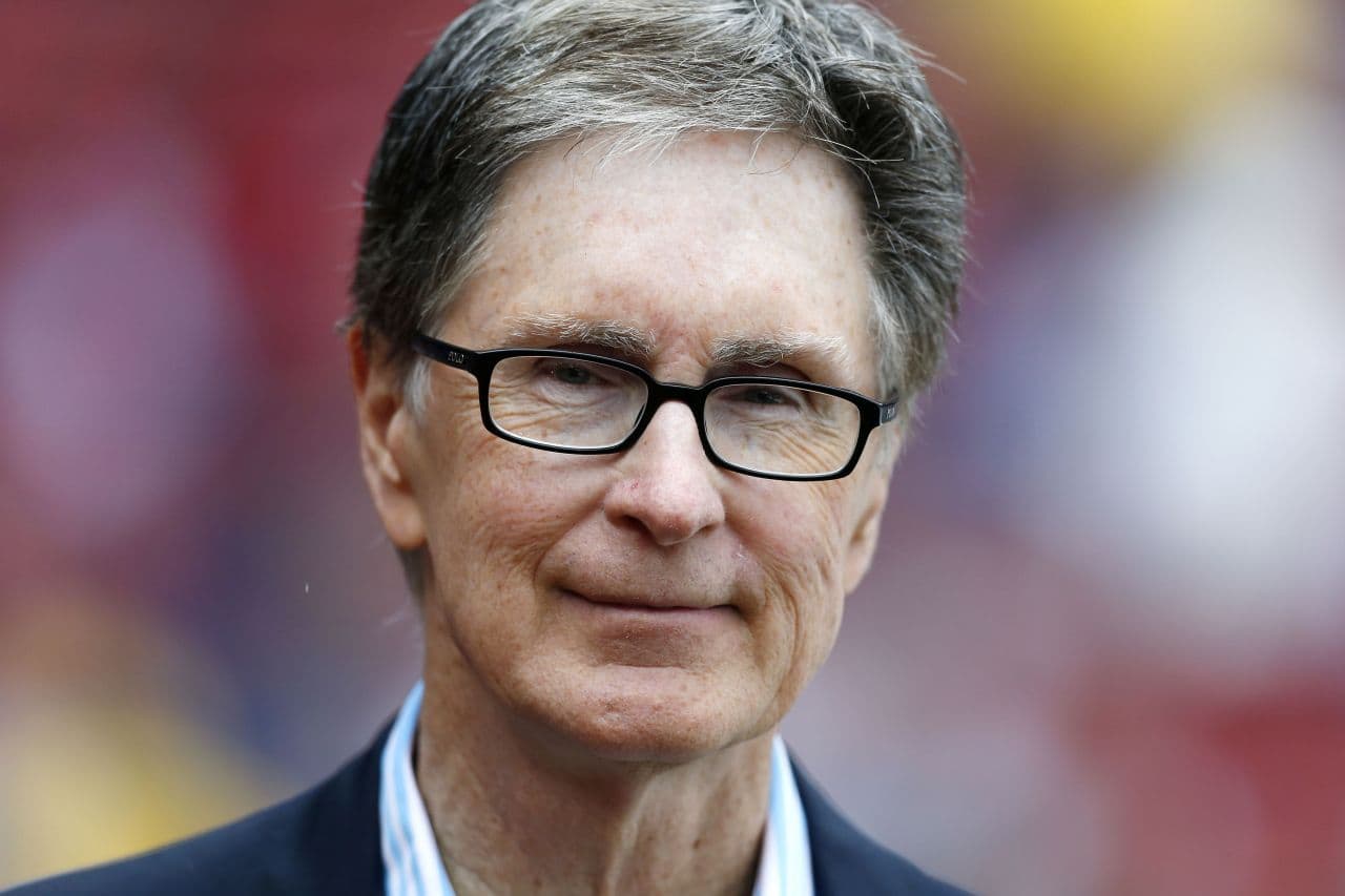 Boston Red Sox owner John Henry stands on the field before a baseball game between the Boston Red Sox and the Toronto Blue Jays in Boston, Saturday, May 11, 2013. (Michael Dwyer/AP)
