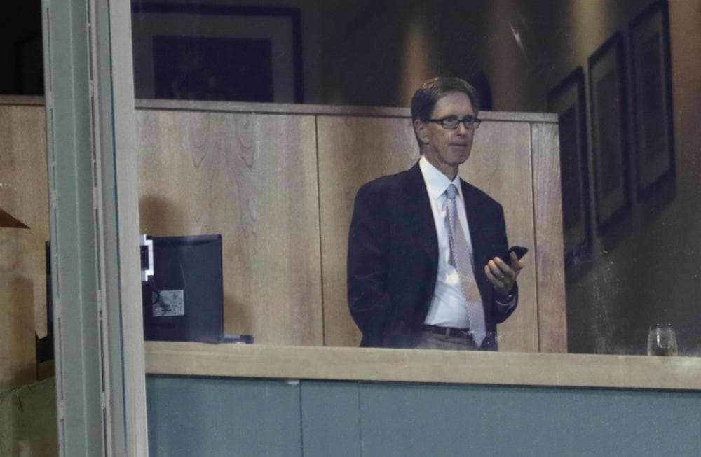 Boston Red Sox majority owner John Henry watches a baseball game between the Boston Red Sox and Arizona Diamondbacks during the second inning at Fenway Park in Boston, Friday, Aug. 2, 2013. (AP)
