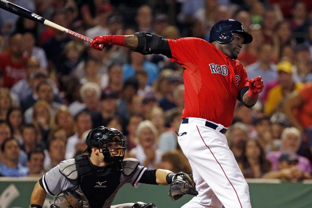 Red Sox designated hitter David Ortiz, right, hits a two-run single  during the fourth inning at Fenway Park, Friday. (AP Photo/Elise Amendola)
