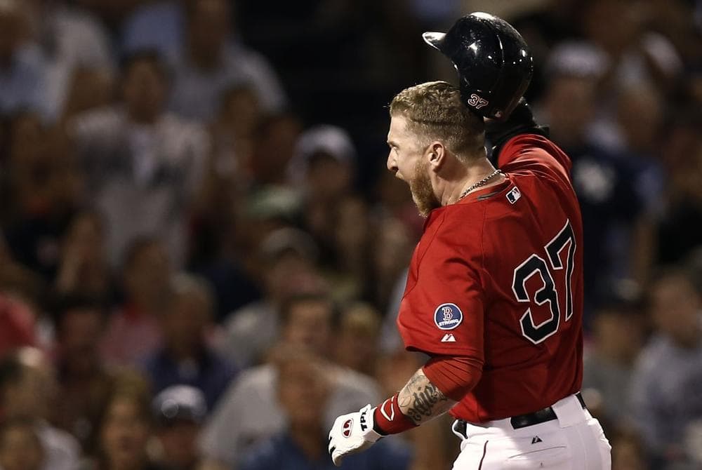 Boston Red Sox's Mike Carp throws his helmet after being called out on strikes and then thrown out of the game by home plate umpire Bill Welke during the seventh inning.(AP) 