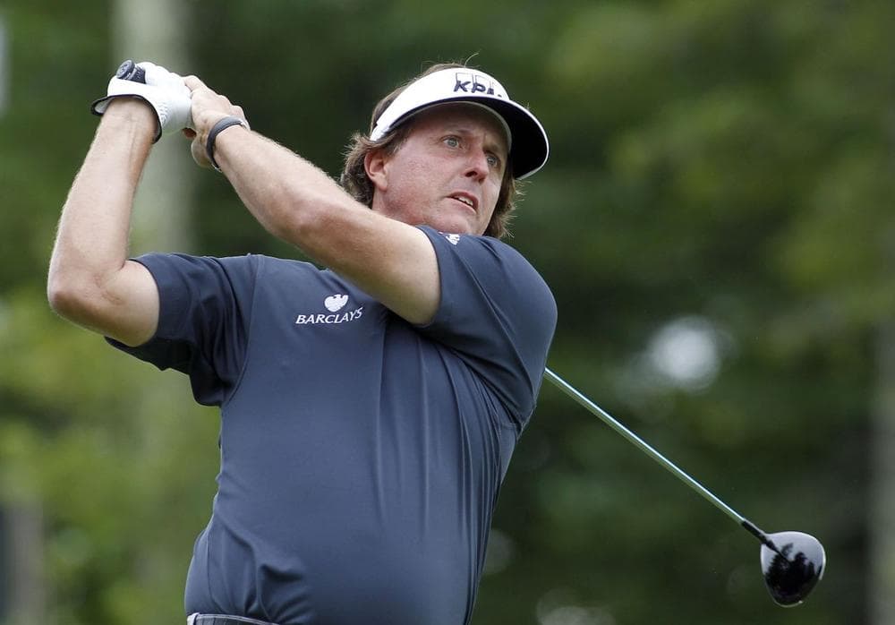 Phil Mickelson hits his tee shot on the 12th hole during the first round of the Deutsche Bank Championship golf tournament in Norton, Mass., Friday, Aug. 30, 2013. (AP Photo/Stew Milne)
