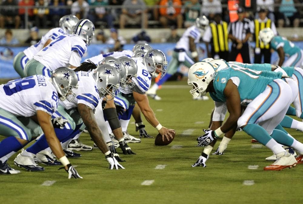 The Dallas Cowboys and the Miami Dolphins line up in the fourth quarter at the Pro Football Hall of Fame exhibition football game Sunday, Aug. 4, 2013, in Canton, Ohio. (AP Photo/David Richard)