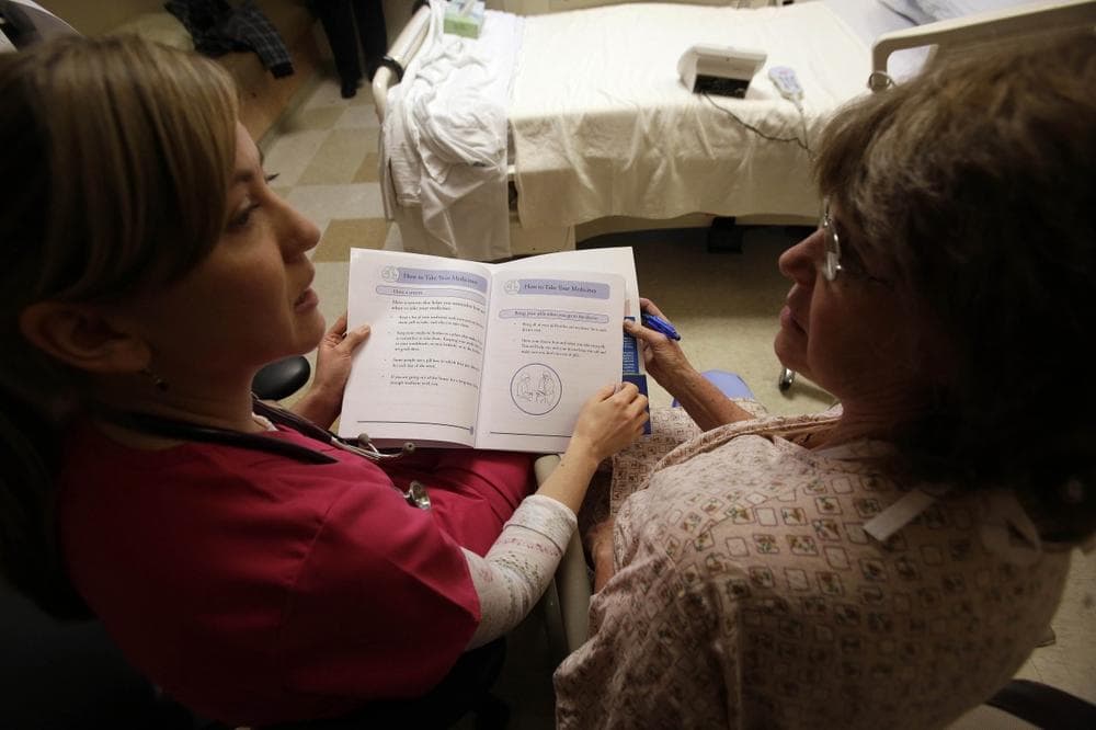 Patient Marlena Bechtel-Rysdam goes over home monitoring training materials with registered nurse Christina Leese at Oregon Health Sciences University in Portland, Ore. (AP/Don Ryan)
