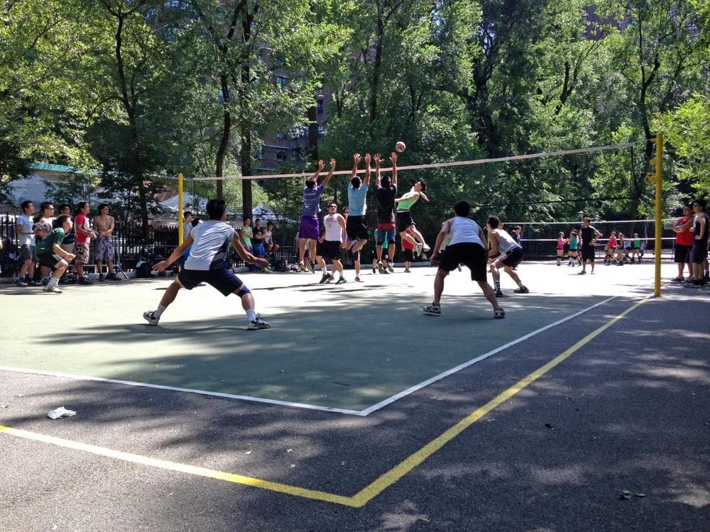 Regular volleyball features six players per side. Nine-man requires a wider court, which is marked by a yellow line in New York's Seward Park. (Christine Lakowski/Only A Game)