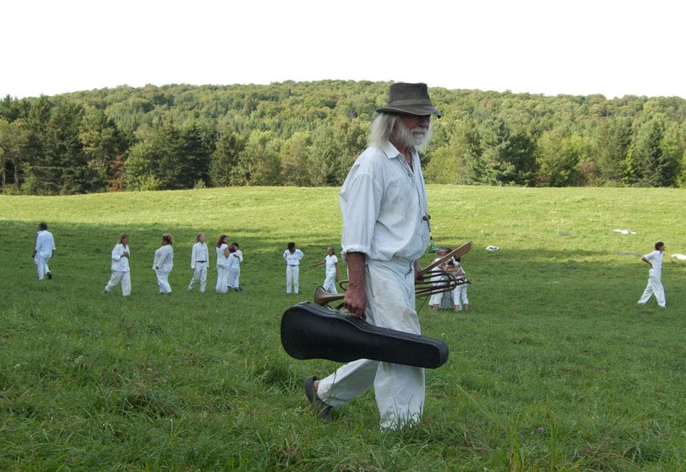 Peter Schumann walks off the field after a pageant performance in Glover, Vermont. (Greg Cook)