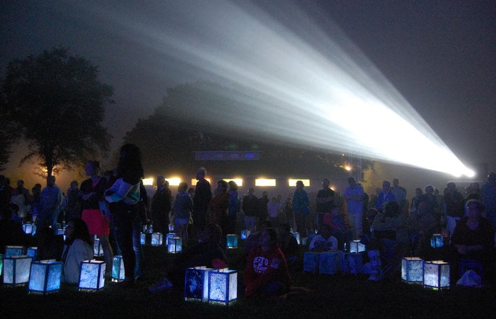 Hundreds gathered on the lawn of South Boston’s Castle Island Park in August 2013 for a screening and lantern walk organized by Medicine Wheel to mark the 50th anniversary of Martin Luther King Jr. delivering his “I Have a Dream&quot; speech. (Greg Cook)