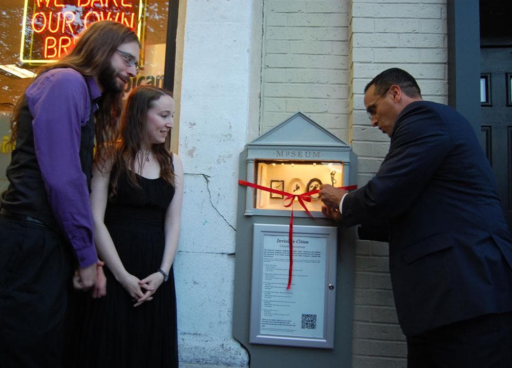 Somerville Mayor Joseph Curtatone cut the ribbon after giving his “official micro speech,” the entirety of which was: “Good evening. Thank you.” (Greg Cook)