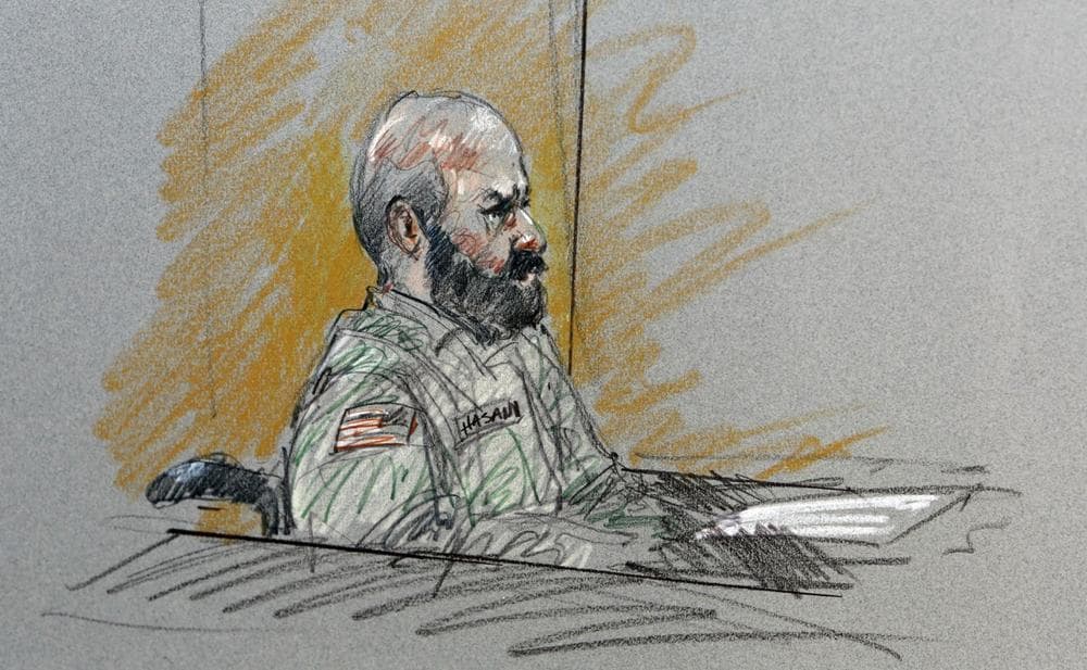 Maj. Nidal Malik Hasan sits in court for his court-martial in Fort Hood, Texas, in this Aug. 6, 2013, courtroom sketch. (Brigitte Woosley/AP)