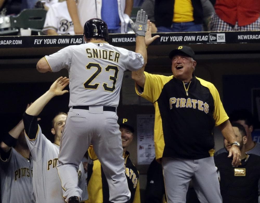 Travis Snider (23) is congratulated on his ninth inning home run helping the Pittsburgh Pirates beat the Milwaukee Brewers on September 3rd, 2013. (Morry Gash/AP)