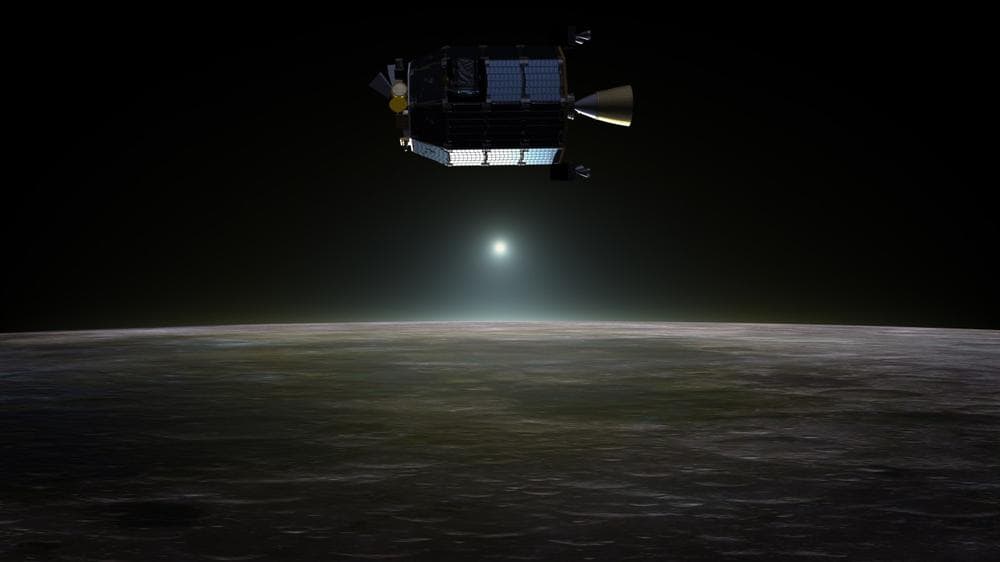 Artist’s concept of NASA's Lunar Atmosphere and Dust Environment Explorer (LADEE) spacecraft in orbit above the moon as dust scatters light during the lunar sunset. LADEE will be launched today. (NASA Ames / Dana Berry