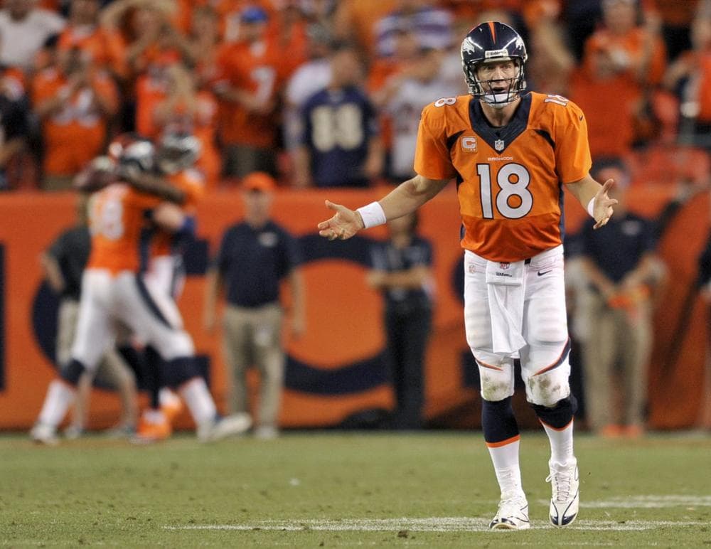 Peyton Manning celebrates his record tying 7th touchdown of the game on September 5th, 2013 against Baltimore Ravens. (Jack Dempsey/AP)
