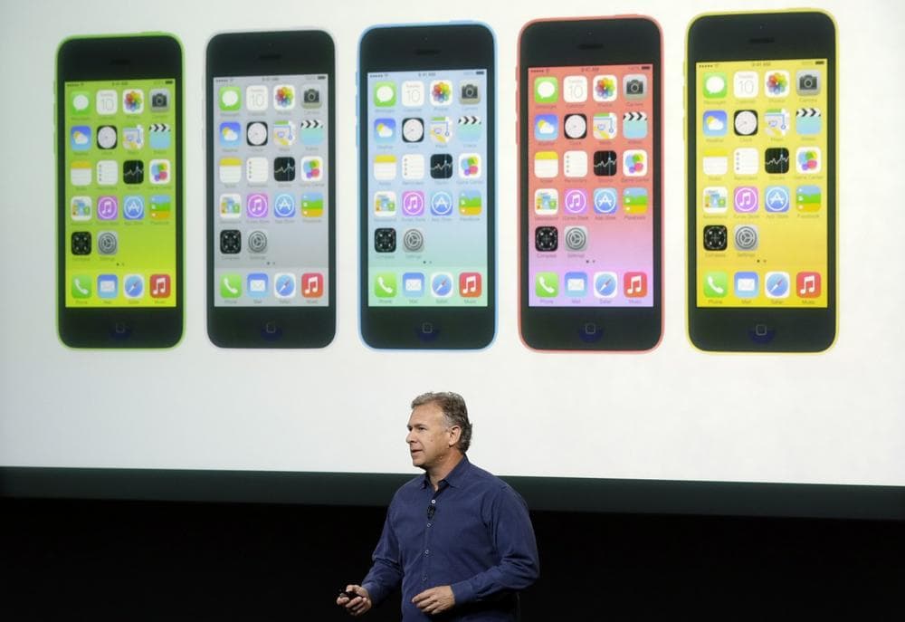Phil Schiller, Apple's senior vice president of worldwide product marketing, speaks on stage during the introduction of the new iPhone 5c in Cupertino, Calif., Tuesday, Sept. 10, 2013. (Marcio Jose Sanchez/AP)