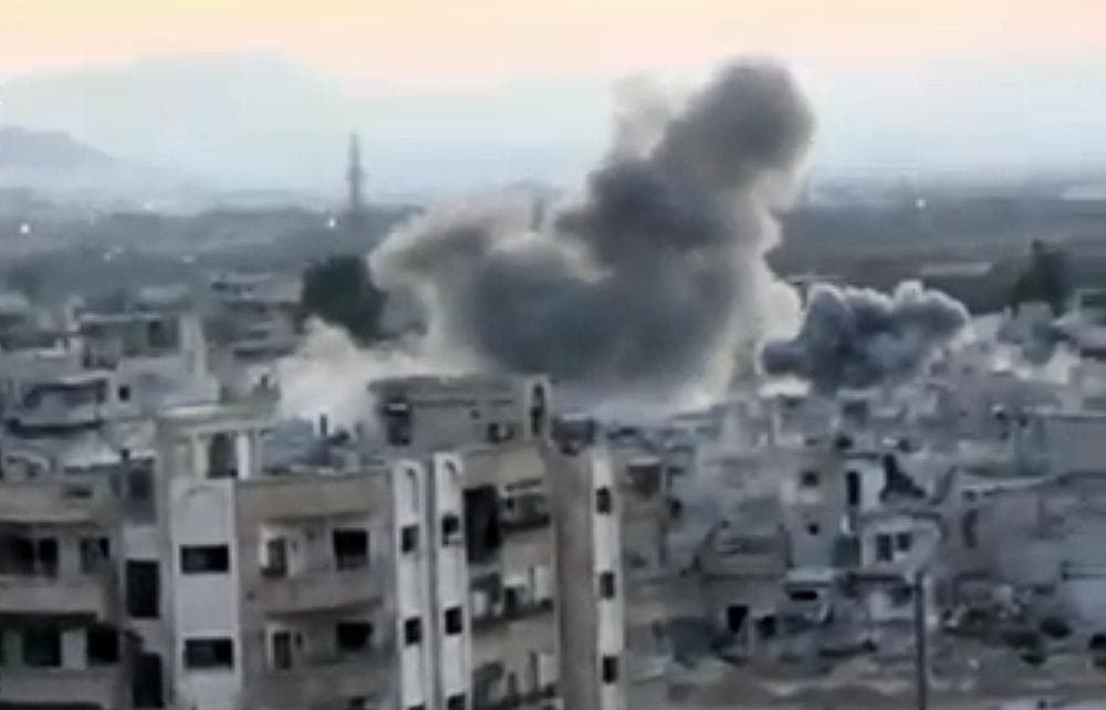 In this image taken from video obtained from the Shaam News Network, which has been authenticated based on its contents and other AP reporting, smoke rises from buildings due to heavy artillery shelling in Barzeh, a district of Damascus, Syria, Tuesday, Sept. 10, 2013. (Shaam News Network via AP video)