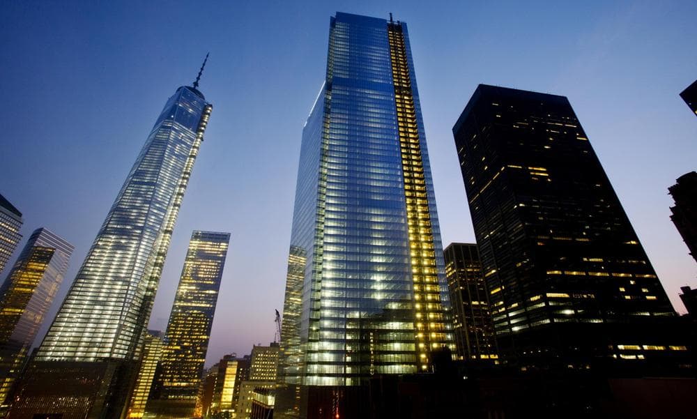 Four World Trade Center, center, stands next to One World Trade Center, left, in lower Manhattan, Wednesday, Sept. 11, 2013 in New York. (Mark Lennihan/AP)