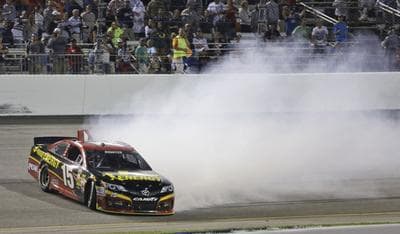 Clint Bowyer spins out during the NASCAR Sprint Cup Series auto race at Richmond International Raceway in Richmond, VA., September 7, 2013. (Steve Helber/AP)