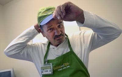 Tom Palome was an executive at Oral-B. Today, the 77-year-old juggles two part-time jobs: one as a $10-an-hour food demonstrator at Sam’s Club, the other flipping burgers and serving drinks at a golf club grill for slightly more than minimum wage. (Phelan M. Ebenhack/Bloomberg)
