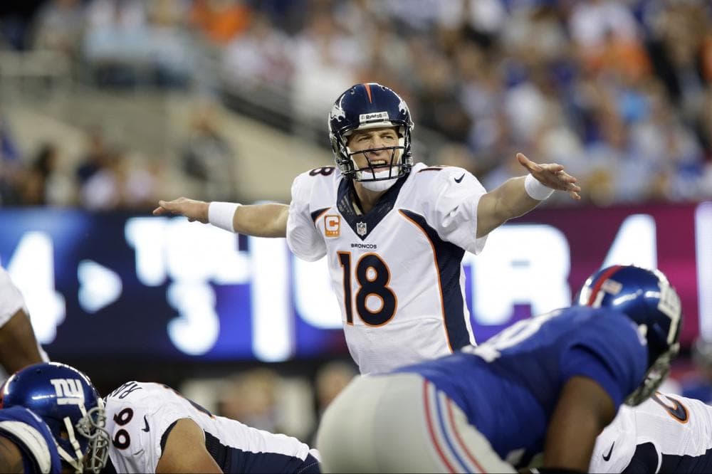 Peyton Manning threw a record 12 touchdowns in the first three games of the season. (Kathy Willens/AP)