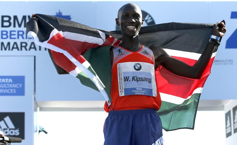 Wilson Kipsang from Kenya celebrates winning the 40th Berlin Marathon in Berlin, Germany, Sunday, Sept. 29, 2013. (Michael Sohn/AP)