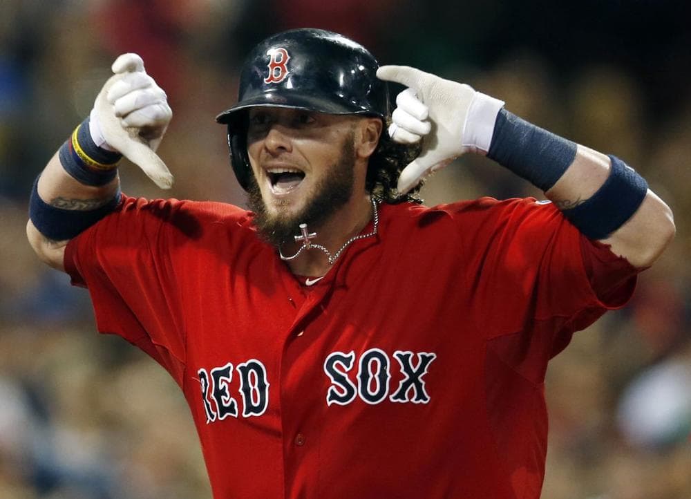 Boston Red Sox's Jarrod Saltalamacchia gestures as he runs toward the dugout after his grand slam in the seventh inning. (AP PHOTO) 