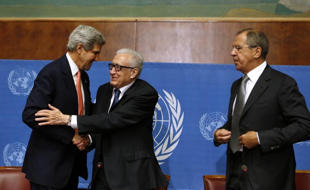 U.S. Secretary of State John Kerry, left, and U.N. Special Representative Lakhdar Brahimi, center, greet each other as Russian Foreign Minister Sergei Lavrov looks on after they delivered a statement to the media after a meeting discussing Syria at the United Nations offices in Geneva, Switzerland, Friday, Sept. 13, 2013