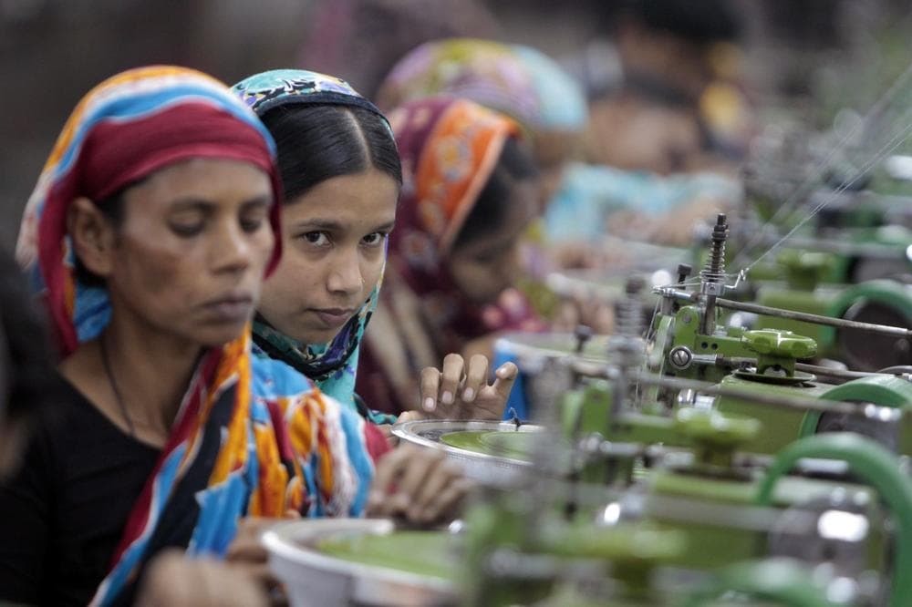In this Saturday, Dec. 8, 2012, photo, Bangladeshi garment workers manufacture clothing in a factory on the outskirts of Dhaka, Bangladesh. (A.M. Ahad/AP)