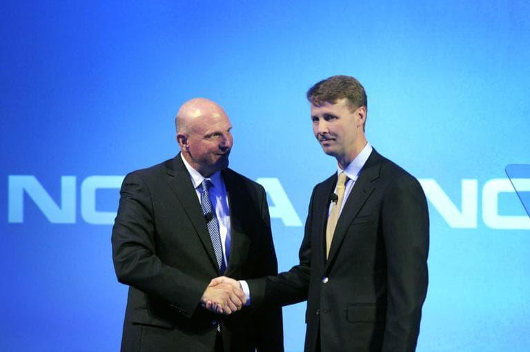 Microsoft CEO Steve Ballmer, left, shakes hands with Nokia's Chairman of the Board Risto Siilasmaa during a press conference in Espoo, Finland on Tuesday, Sept. 3, 2013. (AP)
