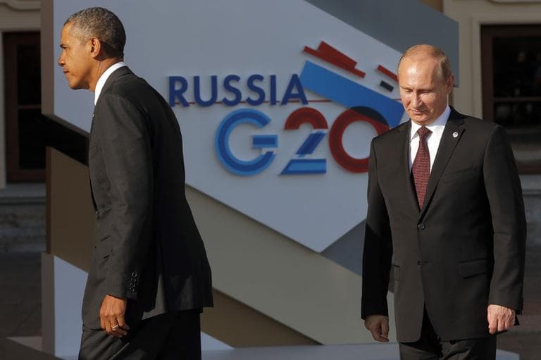 U.S. President Barack Obama, left, walks away after shaking hands with Russia's President Vladimir Putin during arrivals for the G-20 summit at the Konstantin Palace in St. Petersburg, Russia on Thursday, Sept. 5, 2013. (AP)