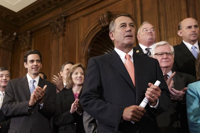 Speaker of the House John Boehner, R-Ohio, is cheered as Republican members of the House of Representatives rally after passing a bill that would prevent a government shutdown while crippling the health care law that was the signature accomplishment of President Barack Obama's first term, at the Capitol in Washington, Friday, Sept. 20, 2013. (AP)